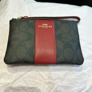 Coach Signiture wristlet with beautiful red stripe